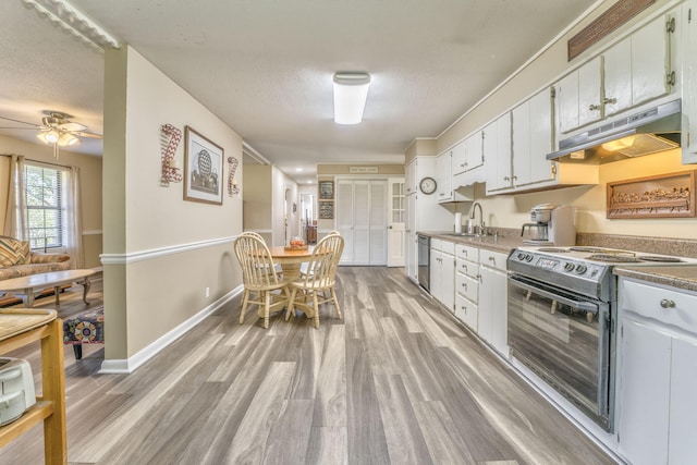 kitchen featuring dishwasher, white cabinetry, light wood-type flooring, and electric stove