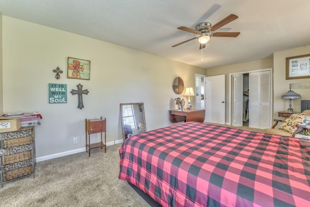 bedroom with ceiling fan, a closet, and light carpet