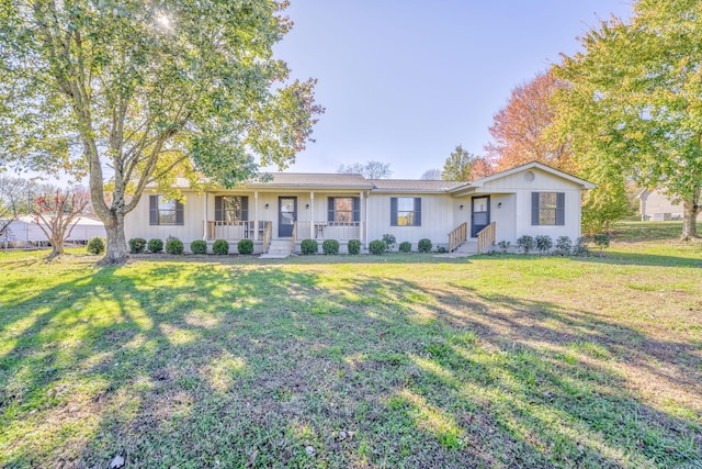 ranch-style home with a porch and a front yard