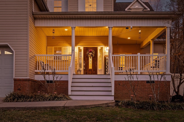 property entrance featuring covered porch