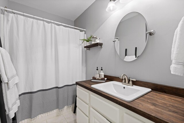 bathroom with vanity and tile patterned flooring