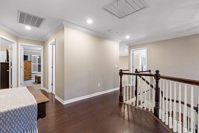 hallway featuring ornamental molding and dark hardwood / wood-style flooring