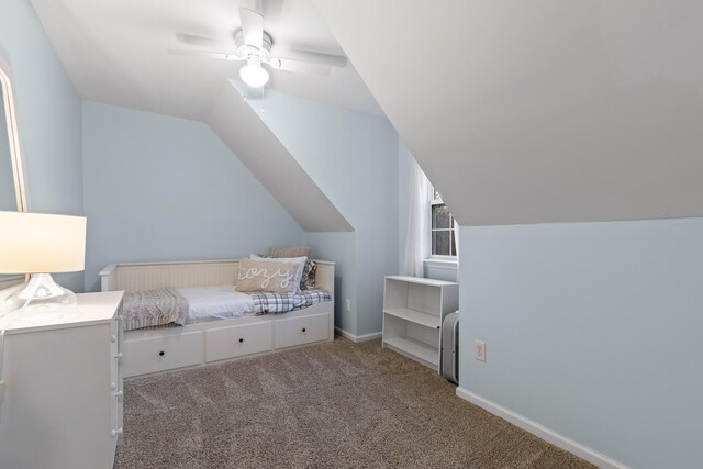 carpeted bedroom with ceiling fan and lofted ceiling