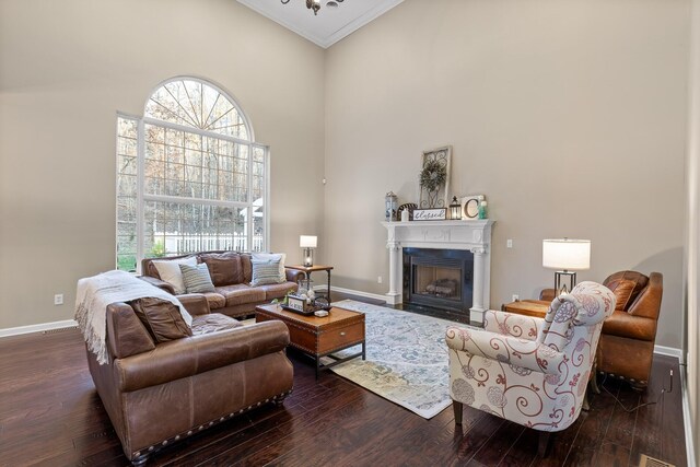 living room featuring ornamental molding, high vaulted ceiling, and dark hardwood / wood-style flooring