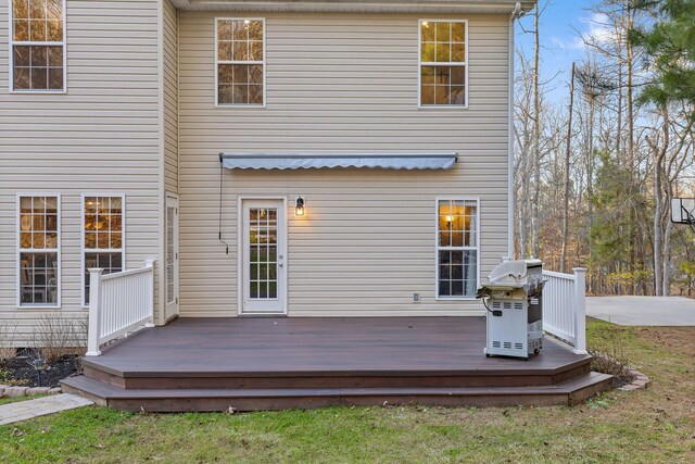 rear view of property featuring a deck