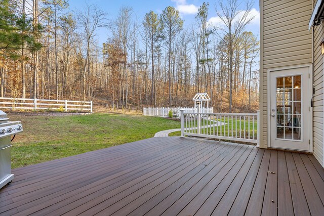 deck featuring a lawn