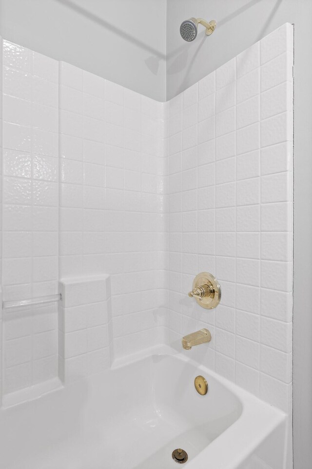 bathroom featuring  shower combination