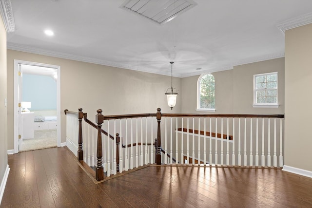 hall with crown molding and hardwood / wood-style flooring