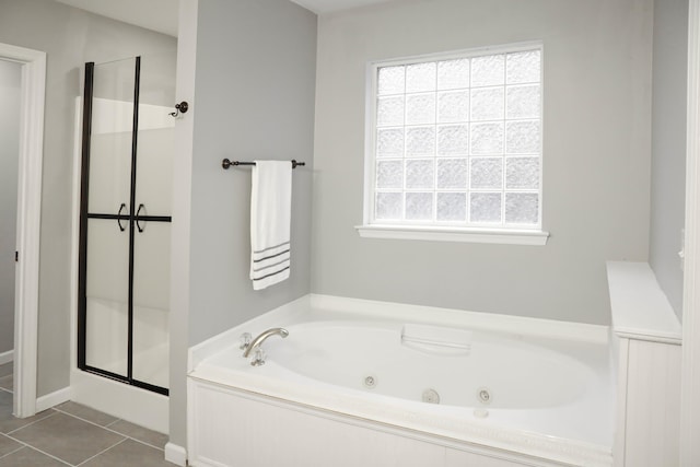 bathroom with tile patterned floors and plus walk in shower