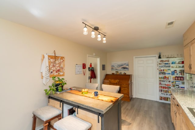 dining area with dark hardwood / wood-style flooring