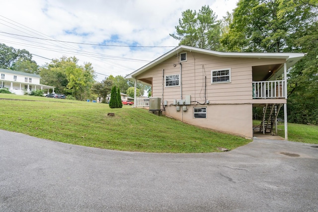 view of home's exterior with a yard