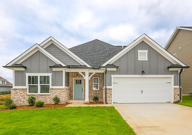 craftsman-style house with a front yard and a garage