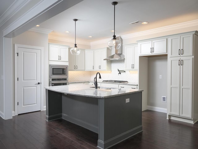 kitchen with white cabinetry, light stone countertops, dark hardwood / wood-style floors, and appliances with stainless steel finishes