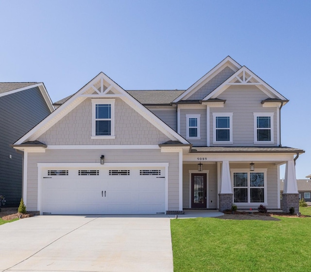 9089 Knolling Loop Unit 87, Ooltewah, TN 37363 - craftsman-style house featuring driveway, a front yard, a porch, and a garage