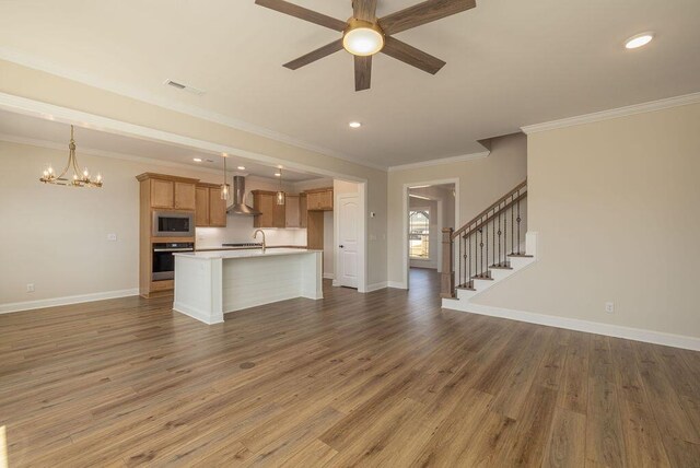 9089 Knolling Loop Unit 87, Ooltewah, TN 37363 - unfurnished living room with a ceiling fan, a chandelier, ornamental molding, recessed lighting, and baseboards