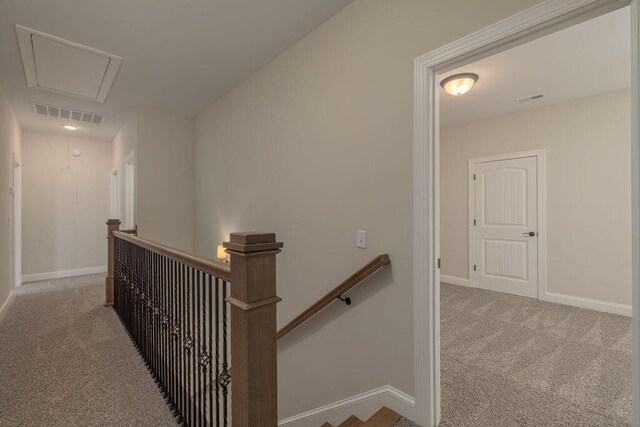 9089 Knolling Loop Unit 87, Ooltewah, TN 37363 - hall featuring an upstairs landing, attic access, carpet flooring, and baseboards