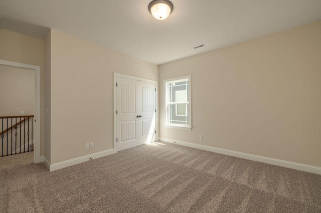 9089 Knolling Loop Unit 87, Ooltewah, TN 37363 - spare room with carpet floors and baseboards