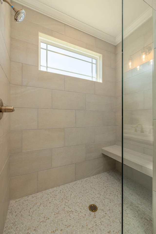 9089 Knolling Loop Unit 87, Ooltewah, TN 37363 - bathroom featuring ornamental molding and a tile shower