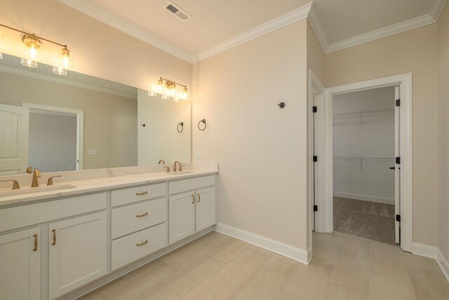 9089 Knolling Loop Unit 87, Ooltewah, TN 37363 - bathroom featuring baseboards, ornamental molding, double vanity, and a walk in closet