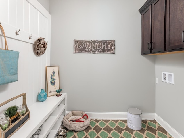 washroom featuring hookup for a washing machine, carpet floors, and cabinets