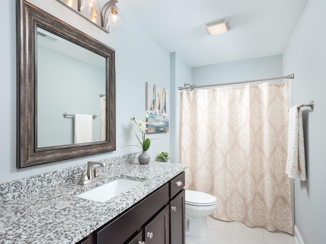 bathroom featuring tile patterned flooring, vanity, a shower with shower curtain, and toilet