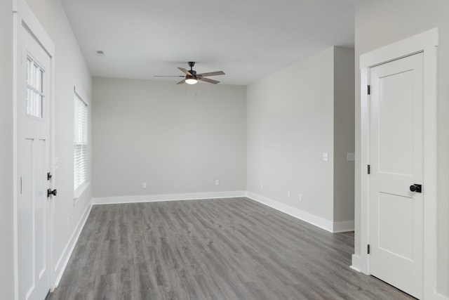 empty room featuring hardwood / wood-style floors and ceiling fan