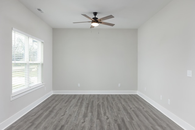 spare room featuring ceiling fan and hardwood / wood-style flooring