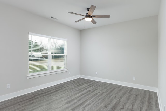 empty room featuring hardwood / wood-style floors and ceiling fan