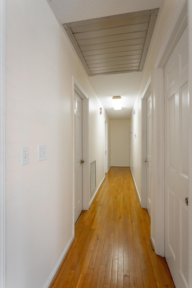 hallway featuring light hardwood / wood-style flooring