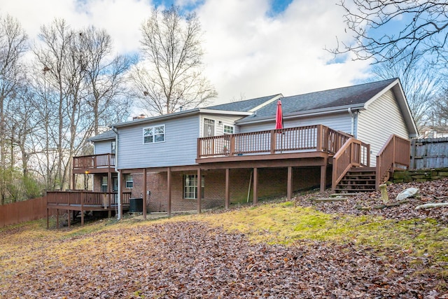 back of house with central AC and a deck