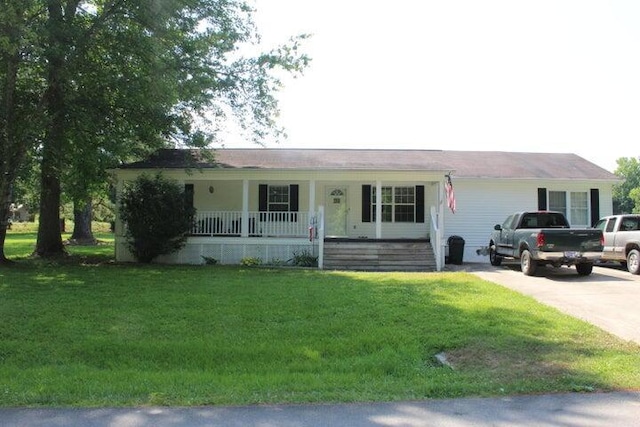 ranch-style house with a front yard and a porch