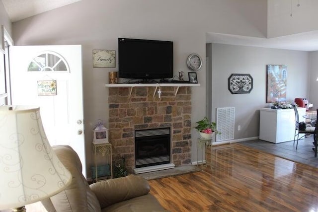 living room featuring a fireplace and hardwood / wood-style floors