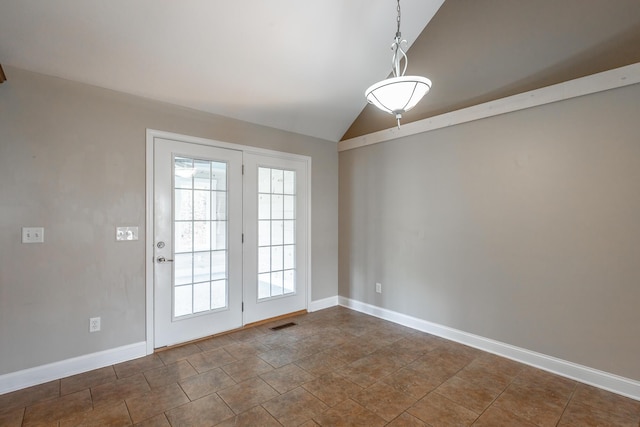 entryway with lofted ceiling, visible vents, and baseboards