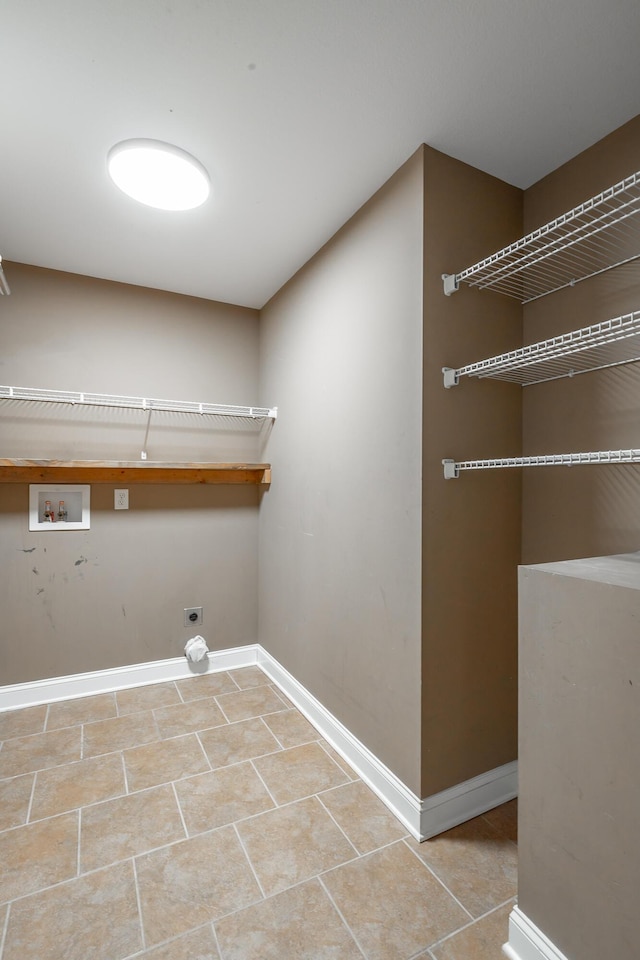 washroom with laundry area, washer hookup, electric dryer hookup, and baseboards