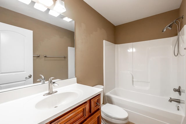 full bath featuring  shower combination, vanity, and toilet