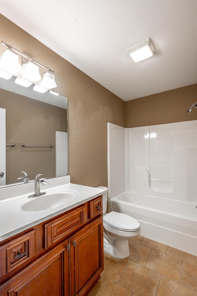 full bath featuring tile patterned floors, vanity, toilet, and bathing tub / shower combination