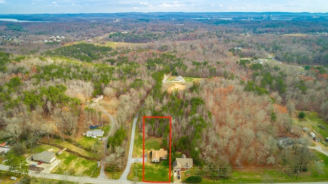 bird's eye view featuring a forest view