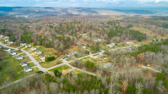 bird's eye view featuring a wooded view