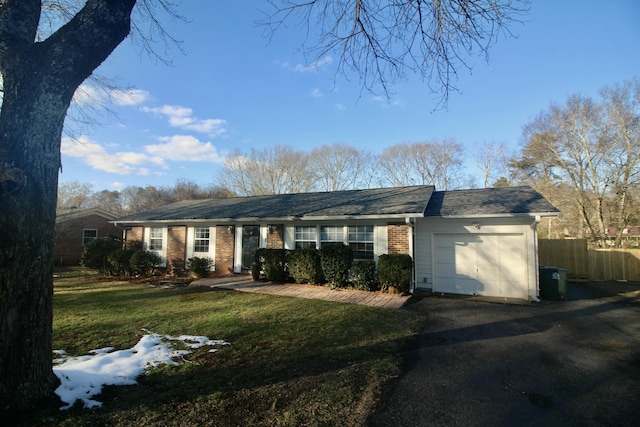 ranch-style house with a front lawn and a garage