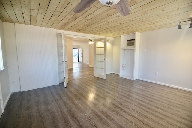 spare room with french doors, a wall unit AC, ceiling fan, wood-type flooring, and wooden ceiling