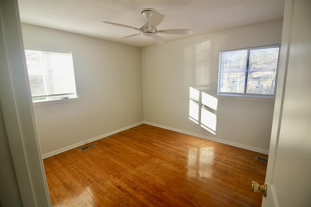 spare room with ceiling fan and light hardwood / wood-style flooring