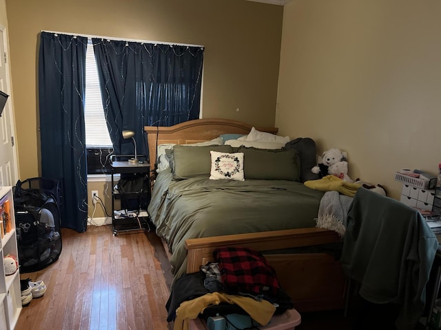 bedroom featuring wood-type flooring