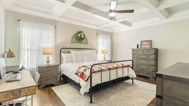 bedroom with beamed ceiling, hardwood / wood-style flooring, ceiling fan, and coffered ceiling