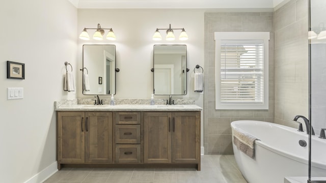 bathroom featuring tile patterned floors, vanity, a bath, and tile walls