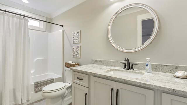 full bathroom featuring vanity, toilet, shower / bathtub combination with curtain, and ornamental molding