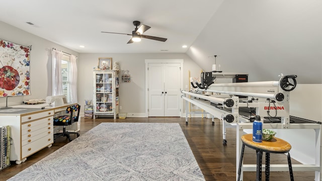 office space featuring ceiling fan, dark wood-type flooring, and vaulted ceiling