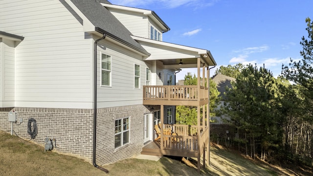 view of home's exterior featuring a wooden deck