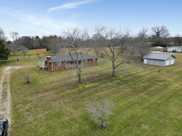 view of yard featuring an outbuilding and a rural view