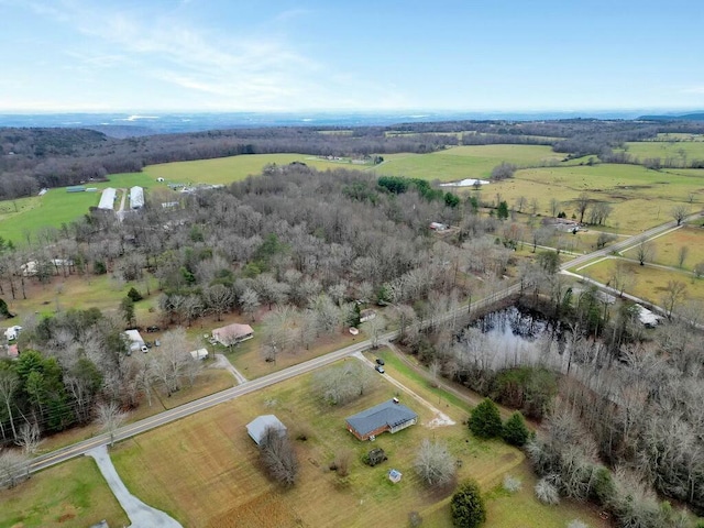 birds eye view of property with a rural view