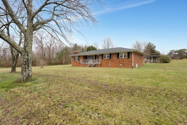 ranch-style home featuring a front yard